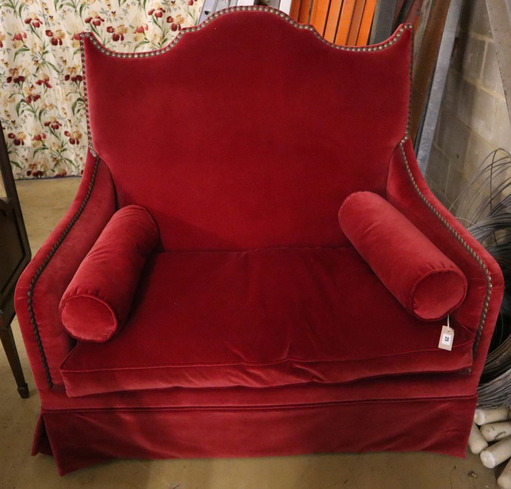 An Yves Halard two-seater sofa covered in red velvet, width 125cm depth 85cm height 132cm